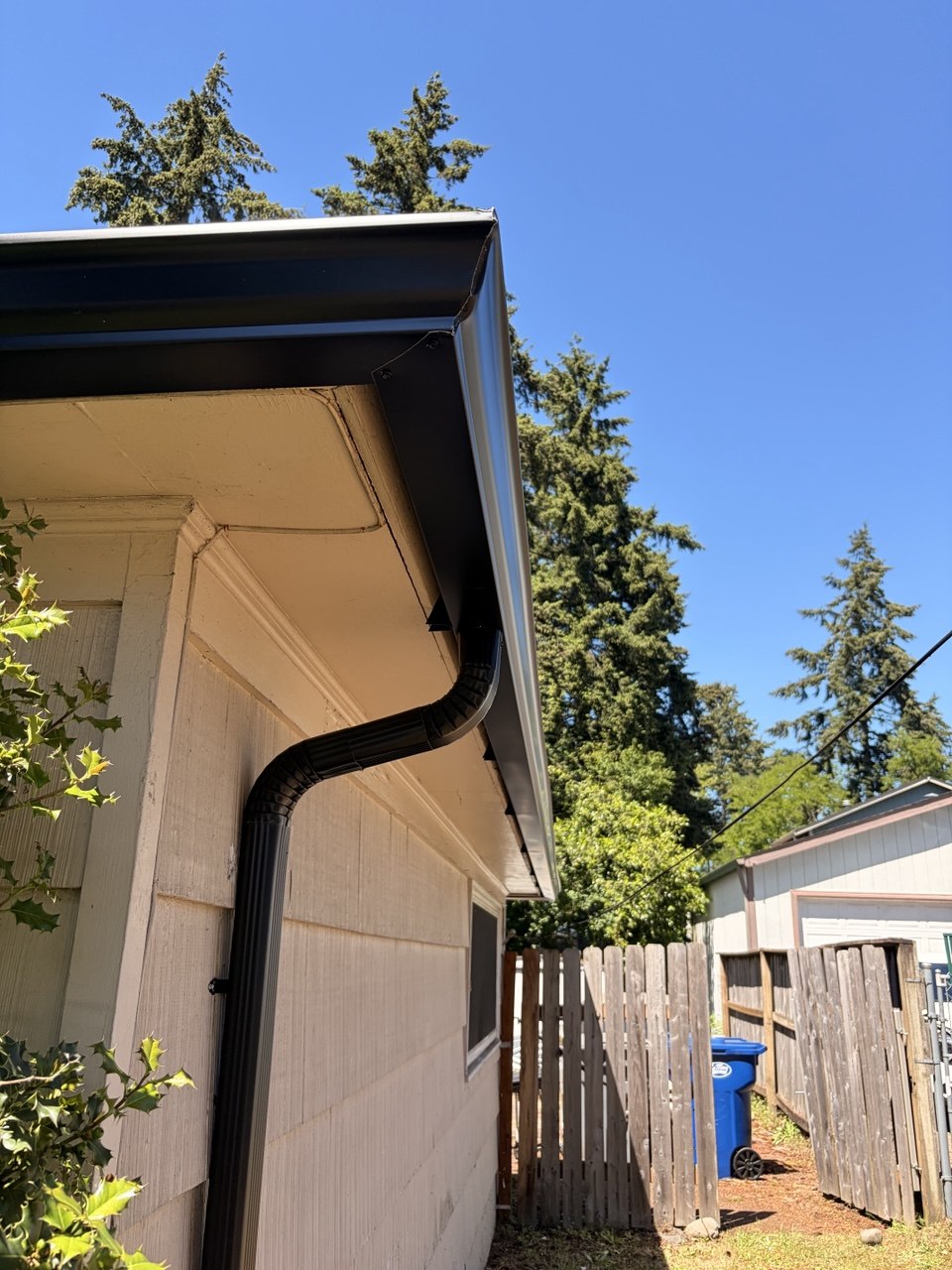Crisp black fascia and gutter detail on a finished Horban roofline